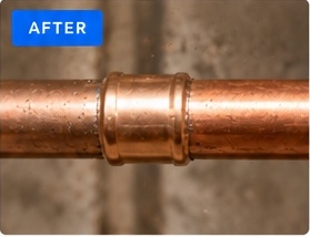 After: copper pipe repaired with a clean copper fitting